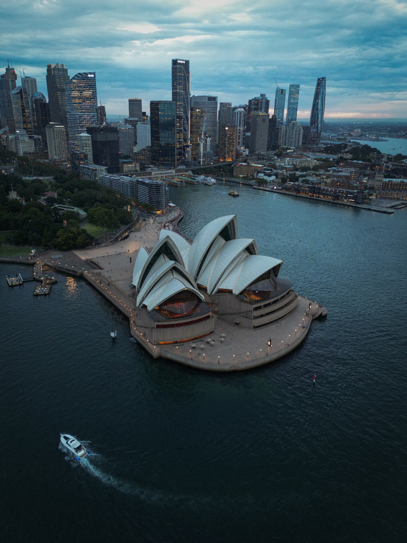 Aerial view of Sydney Opera House and skyline at dusk